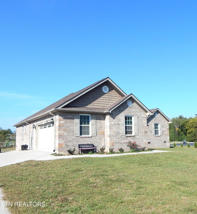 view of front of home featuring a garage and a front lawn