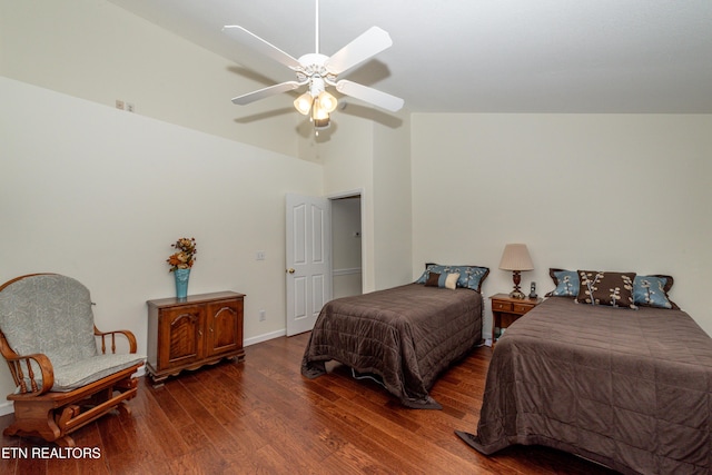 bedroom with ceiling fan, dark wood-type flooring, and lofted ceiling