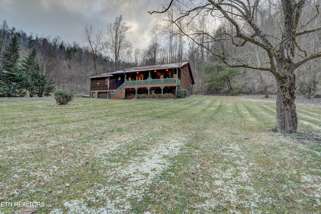 exterior space featuring a deck and a front yard