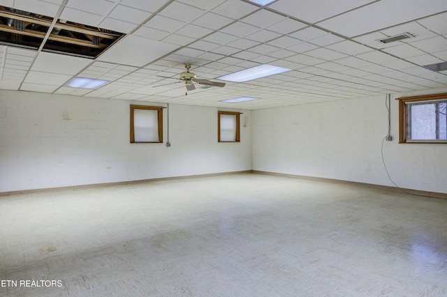 spare room featuring ceiling fan and a drop ceiling