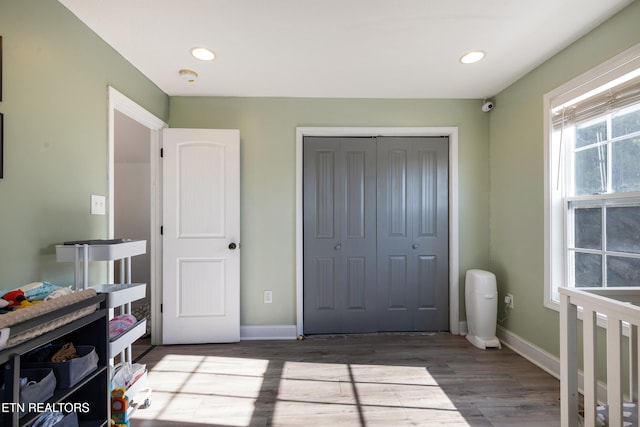 bedroom featuring a closet and dark wood-type flooring