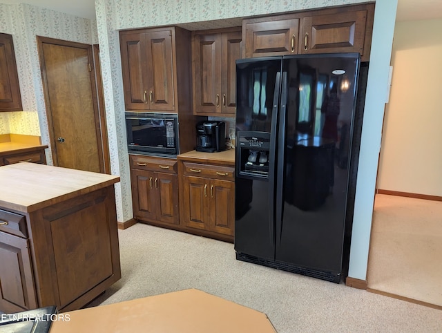 124 Sugarbush Cir, Crossville, TN 38558 - kitchen with butcher block countertops, black appliances, and light carpet