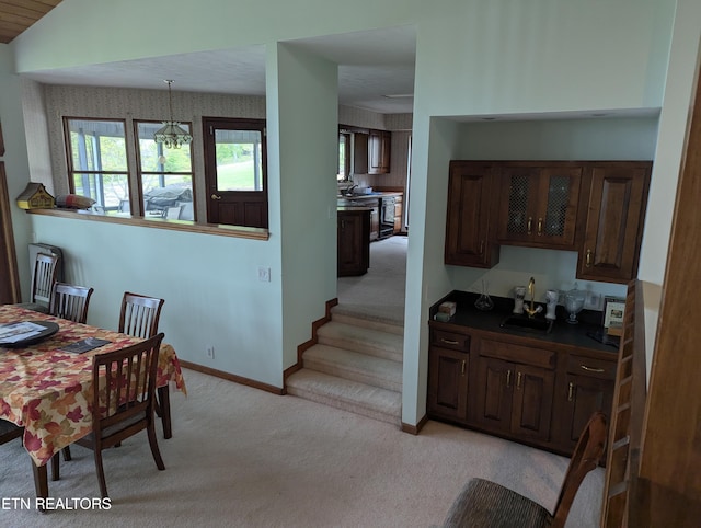 124 Sugarbush Cir, Crossville, TN 38558 - dining space featuring baseboards, vaulted ceiling, wet bar, and light colored carpet