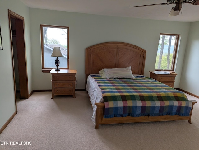 124 Sugarbush Cir, Crossville, TN 38558 - bedroom with baseboards, a ceiling fan, and light carpet