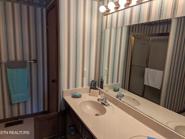 124 Sugarbush Cir, Crossville, TN 38558 - full bathroom featuring a sink, double vanity, and visible vents