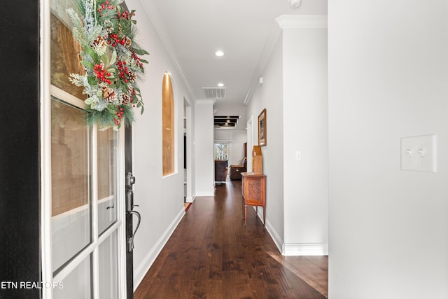 corridor featuring ornamental molding and dark hardwood / wood-style floors