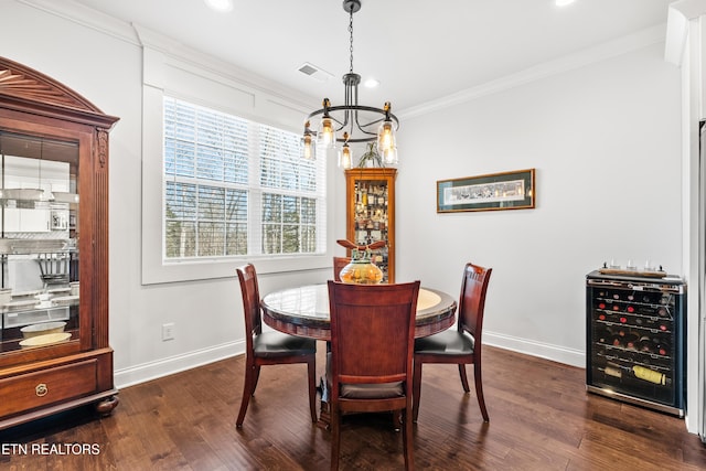 dining area featuring dark hardwood / wood-style flooring, a notable chandelier, crown molding, and beverage cooler