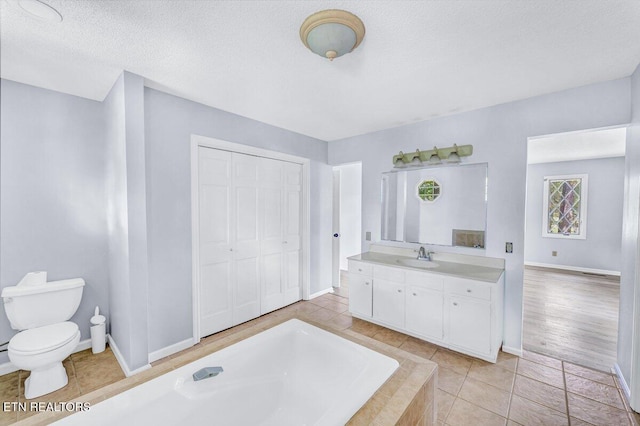 8305 Sharp Rd, Powell, TN 37849 - full bathroom featuring toilet, baseboards, a bath, a textured ceiling, and vanity