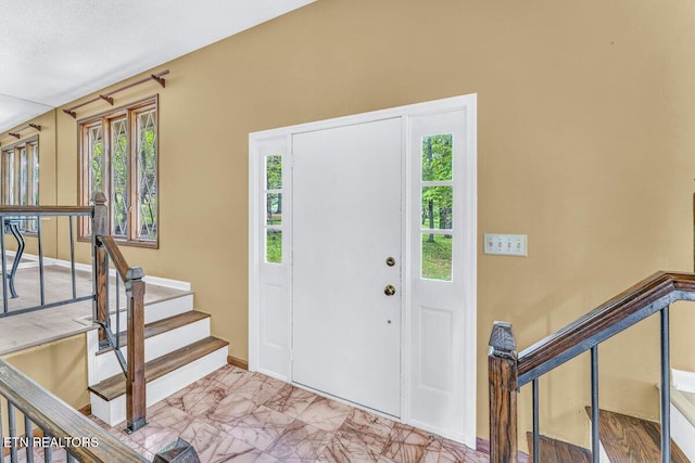 8305 Sharp Rd, Powell, TN 37849 - foyer with marble finish flooring, baseboards, and stairs