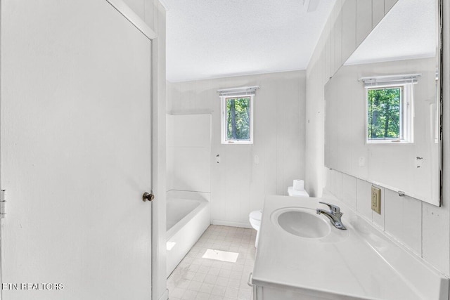 8305 Sharp Rd, Powell, TN 37849 - full bath featuring healthy amount of natural light, toilet, vanity, a textured ceiling, and shower / washtub combination