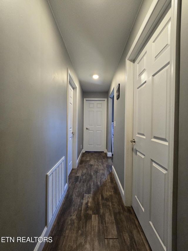 hall featuring dark hardwood / wood-style floors