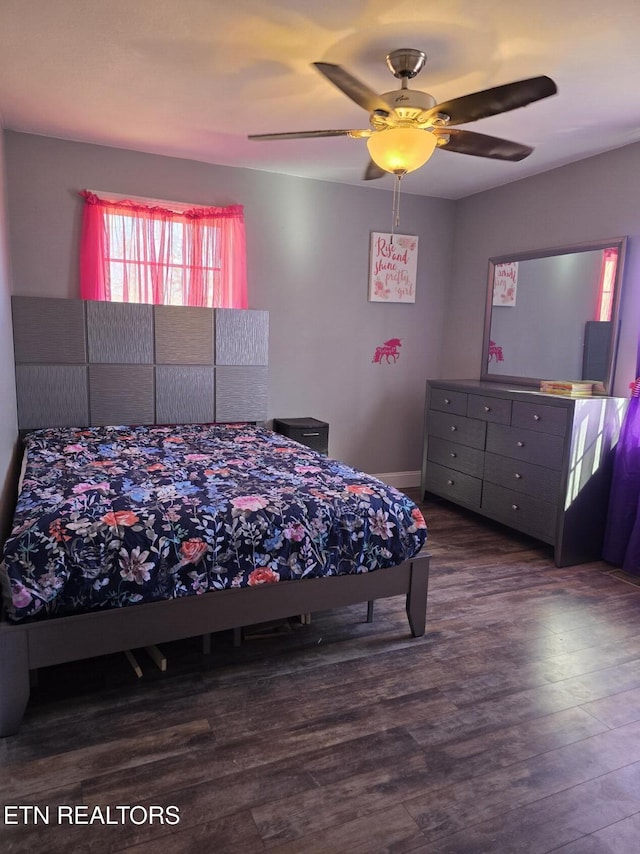 bedroom featuring ceiling fan and hardwood / wood-style floors