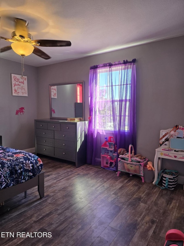 bedroom featuring ceiling fan and wood-type flooring