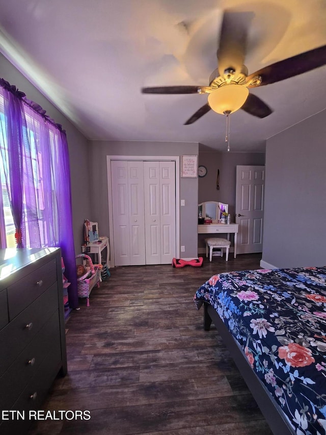 bedroom with ceiling fan, a closet, and dark hardwood / wood-style floors