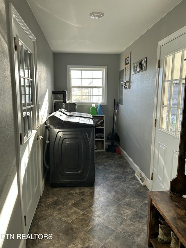 washroom with independent washer and dryer