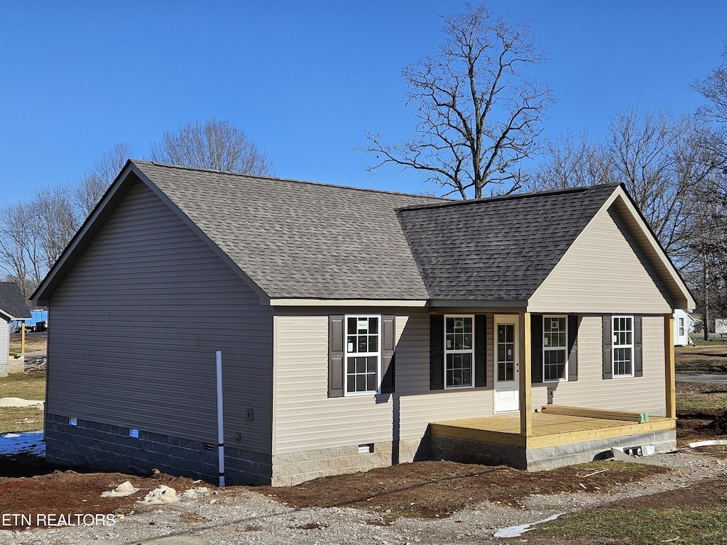 view of property exterior featuring covered porch