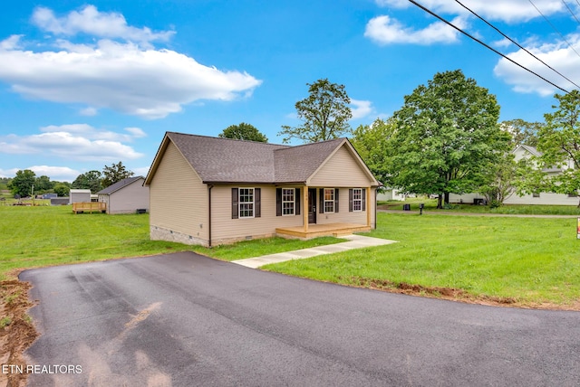 bungalow-style house with crawl space, a front lawn, covered porch, and roof with shingles