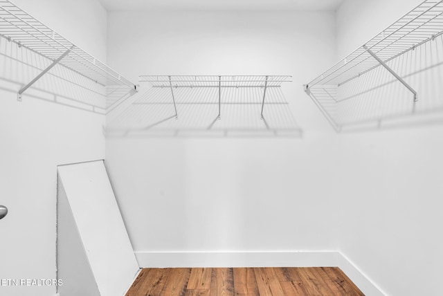 spacious closet with wood finished floors