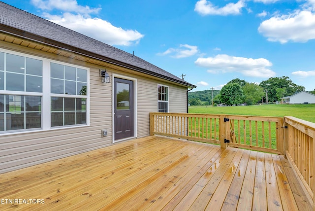 wooden deck with a yard