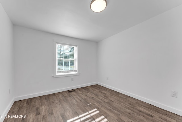 spare room featuring hardwood / wood-style flooring