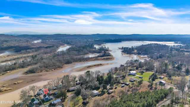 drone / aerial view featuring a water and mountain view