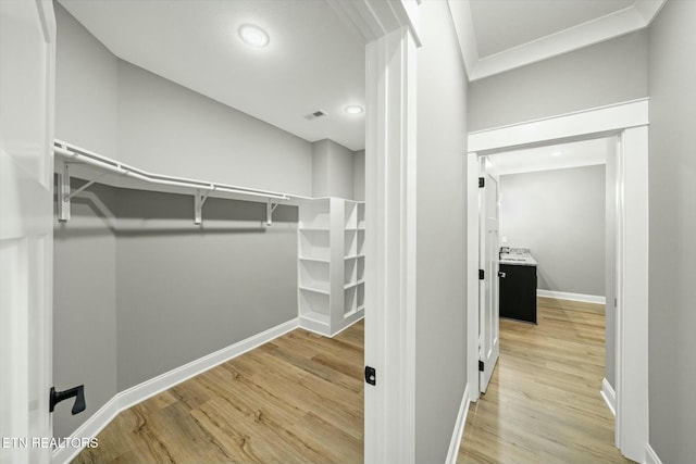 walk in closet featuring light wood-type flooring