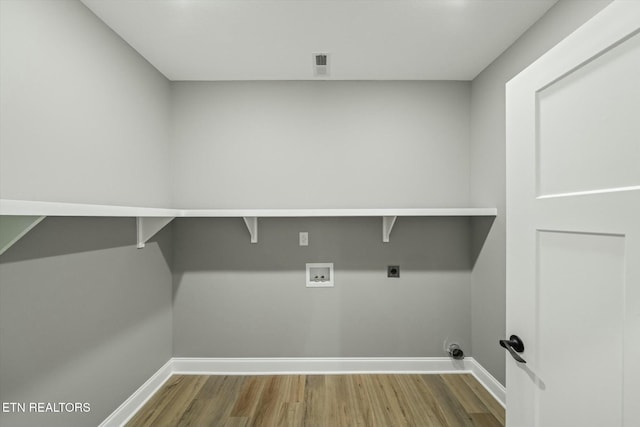 laundry area with hardwood / wood-style flooring, washer hookup, and electric dryer hookup