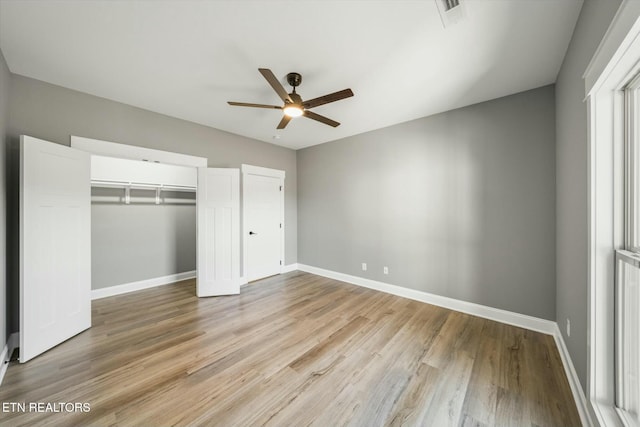 unfurnished bedroom featuring ceiling fan and light wood-type flooring