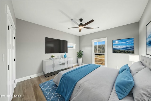 bedroom featuring ceiling fan and light hardwood / wood-style flooring