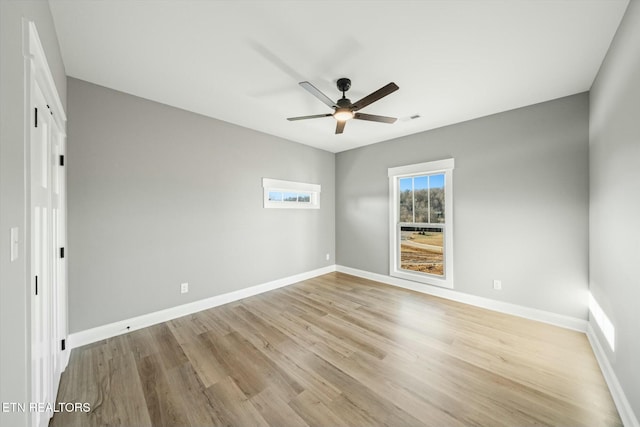 unfurnished room with ceiling fan and light hardwood / wood-style floors