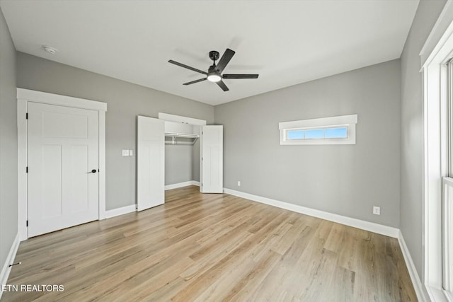 unfurnished bedroom with light hardwood / wood-style floors, a closet, and ceiling fan