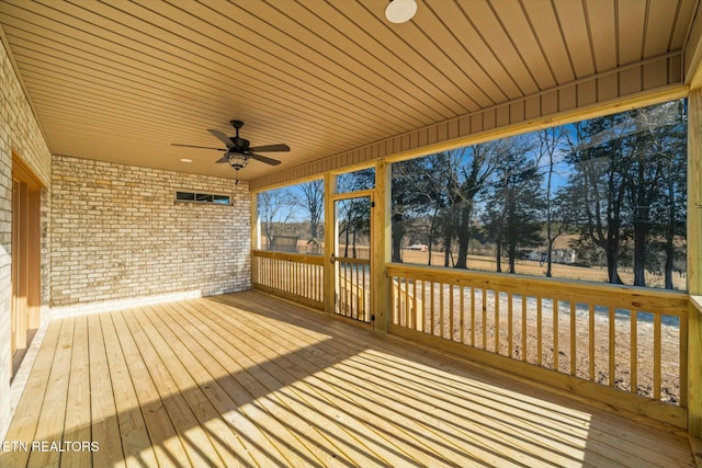 wooden terrace featuring ceiling fan