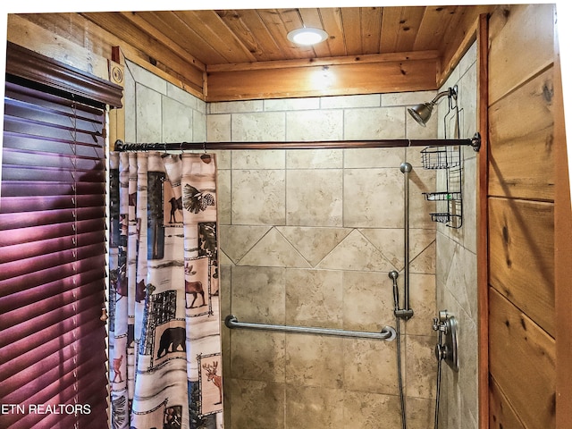 bathroom with wooden ceiling and a shower with curtain