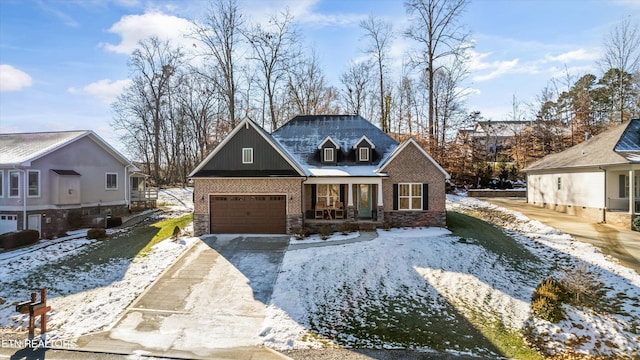 view of front of property featuring a garage and a porch