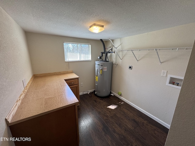 washroom with hookup for an electric dryer, laundry area, washer hookup, water heater, and dark wood finished floors