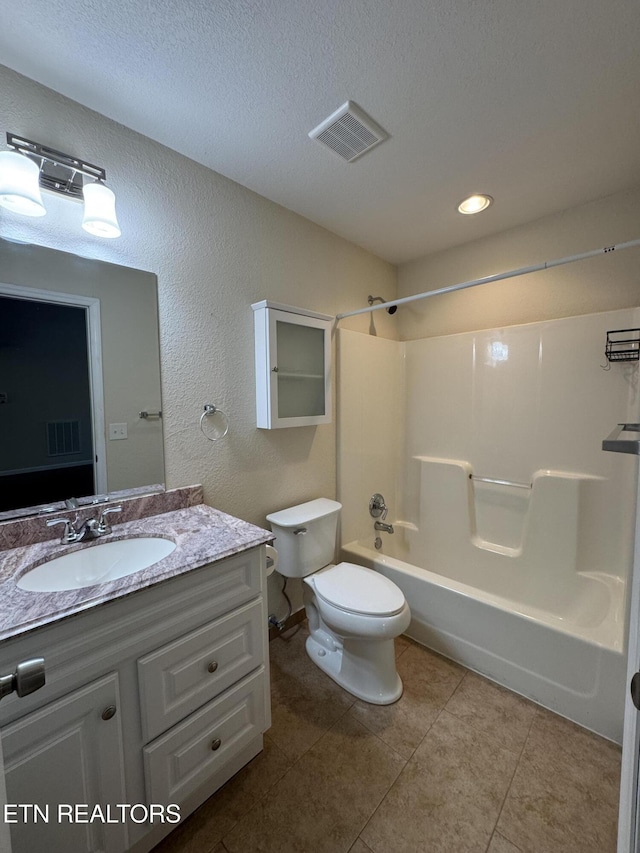 full bath with visible vents, vanity, toilet, and tile patterned floors