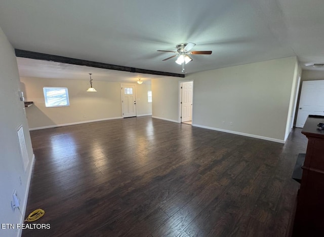 unfurnished living room featuring dark wood-style floors, beam ceiling, ceiling fan, and baseboards