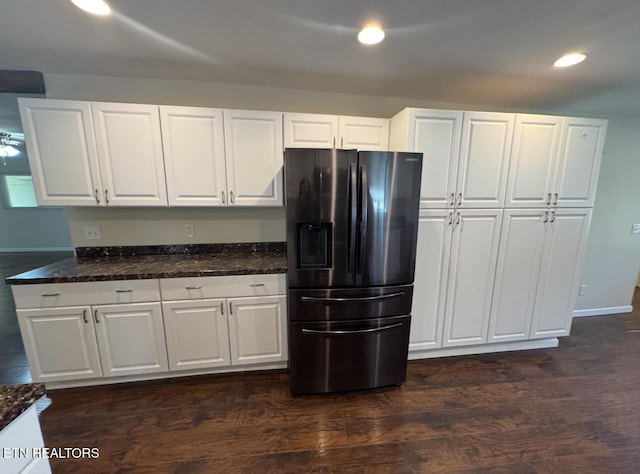 kitchen with dark wood-style floors, recessed lighting, white cabinets, and fridge with ice dispenser