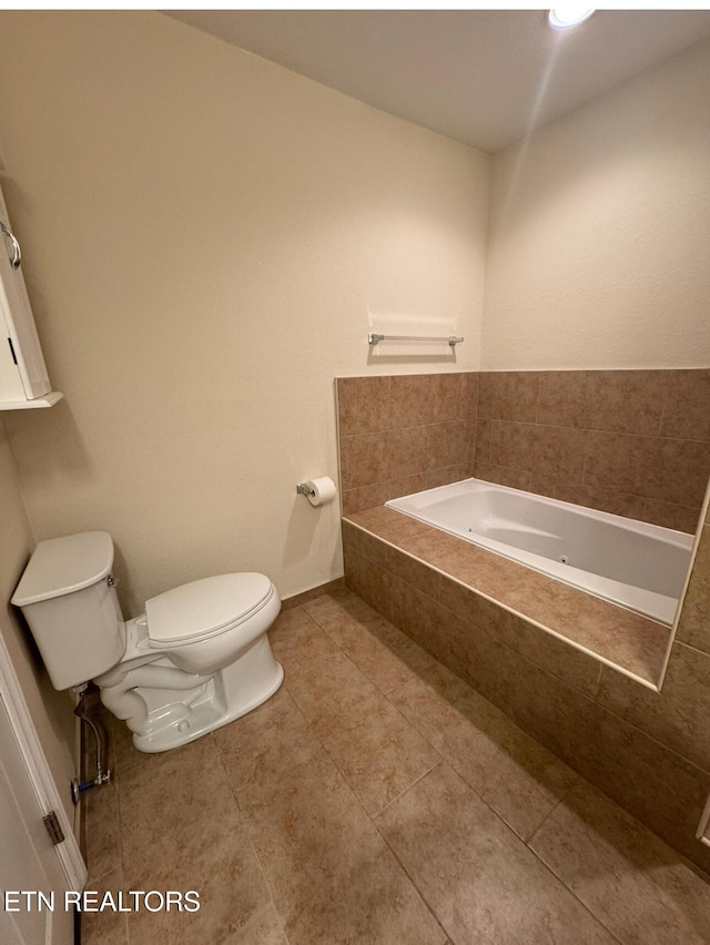 full bathroom with toilet, a garden tub, and tile patterned flooring