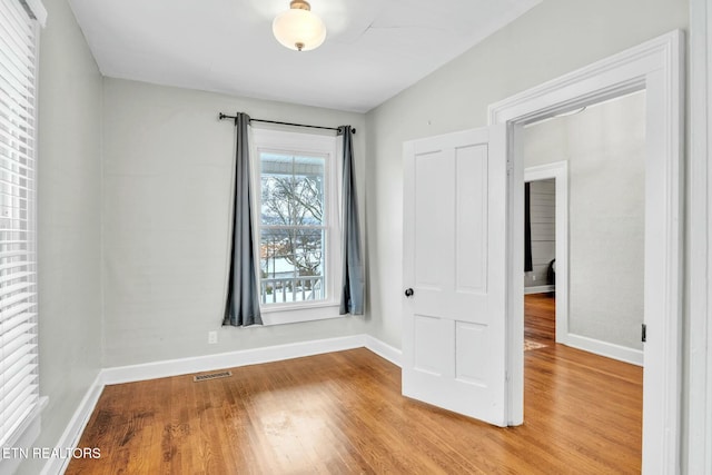 spare room featuring light wood-type flooring