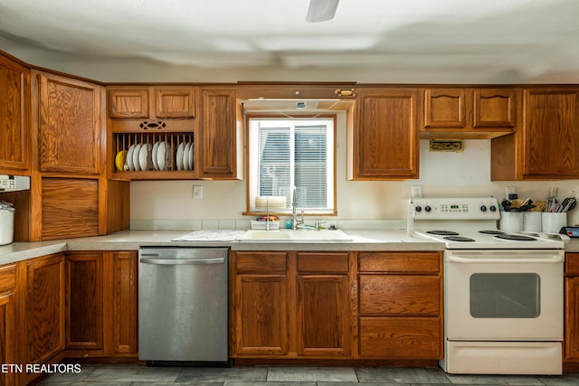 kitchen featuring dishwasher, white range with electric cooktop, and sink