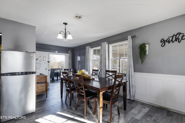 dining area featuring a chandelier