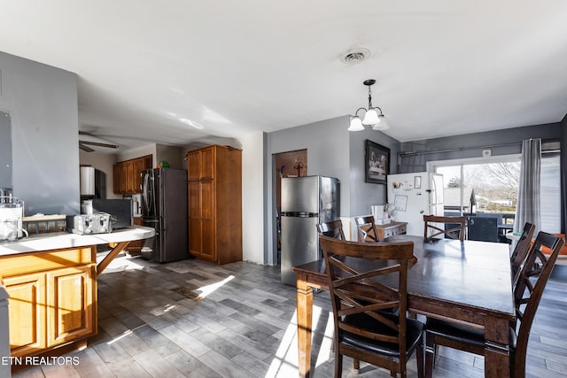 dining area featuring dark hardwood / wood-style floors and a notable chandelier