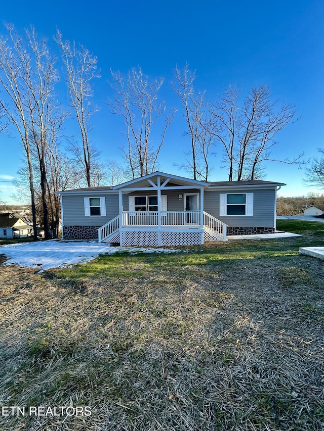 view of front of property with a front lawn and a porch