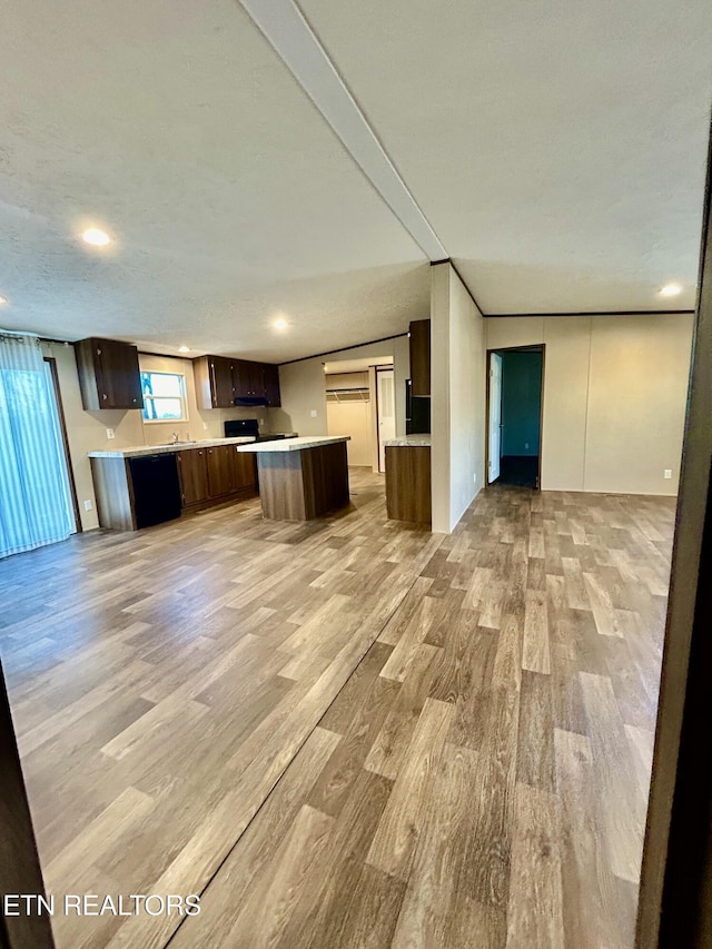 kitchen featuring light hardwood / wood-style flooring and kitchen peninsula