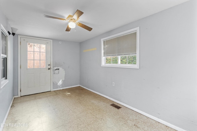 empty room featuring ceiling fan