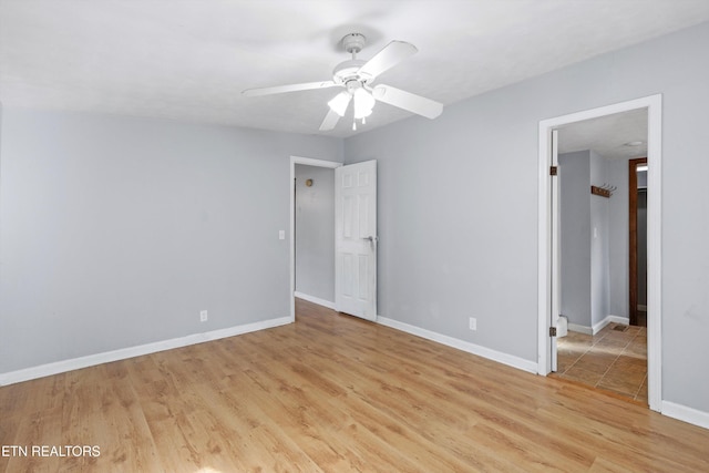 unfurnished bedroom with ceiling fan and light hardwood / wood-style flooring