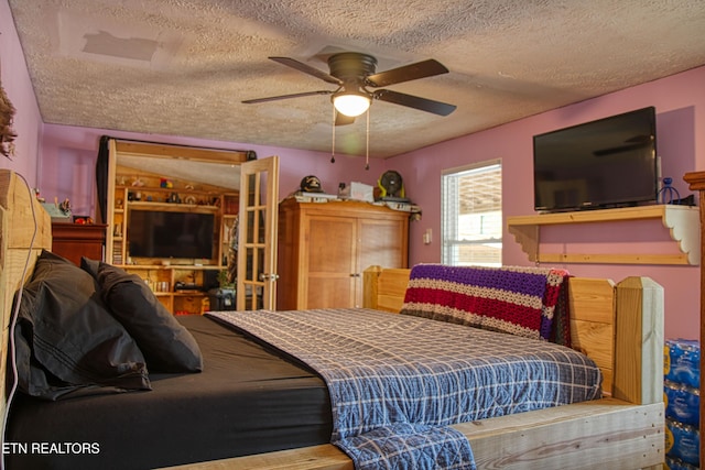 bedroom featuring a textured ceiling and ceiling fan