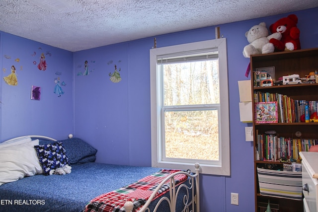 bedroom featuring a textured ceiling