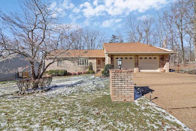 ranch-style home featuring a garage, brick siding, driveway, and a shingled roof